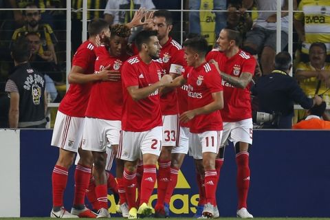 Benfica's Gedson Fernandes, 2nd left, celebrates after scoring the opening goal during the Champions League third qualifying round, second leg, soccer match between Fenerbahce and Benfica at the Sukru Saracoglu stadium in Istanbul, Tuesday, Aug. 14, 2018. (AP Photo/Lefteris Pitarakis)