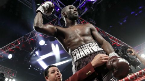 Terence Crawford celebrates after defeating Jeff Horn, of Australia, in a welterweight title boxing match, Saturday, June 9, 2018, in Las Vegas. (AP Photo/John Locher)