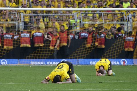 Dortmund's players react after the German Bundesliga soccer match between Borussia Dortmund and FSV Mainz 05 in Dortmund, Germany, Saturday, May 27, 2023. (AP Photo/Michael Probst)