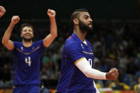 France's Earvin Ngapeth celebrates during a men's preliminary volleyball match against Brazil at the 2016 Summer Olympics in Rio de Janeiro, Brazil, Monday, Aug. 15, 2016. (AP Photo/Matt Rourke)