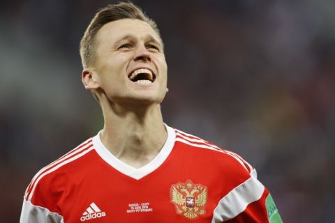 Russia's Denis Cheryshev celebrates after scoring his team second goal during the group A match between Russia and Egypt at the 2018 soccer World Cup in the St. Petersburg stadium in St. Petersburg, Russia, Tuesday, June 19, 2018. (AP Photo/Efrem Lukatsky)