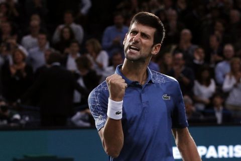 Novak Djokovic of Serbia celebrates after defeating Roger Federer of Switzerland during their semifinal match of the Paris Masters tennis tournament at the Bercy Arena in Paris, France, Saturday, Nov. 3, 2018. (AP Photo/Thibault Camus)