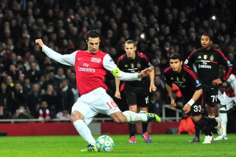Arsenal's Dutch striker Robin Van Persie scores the third goal from a penalty during an UEFA Champions League round of 16 second leg football match against Arsenal at the Emirates Stadium, North London, on March 6, 2012. AFP PHOTO/GIUSEPPE CACACE (Photo credit should read GIUSEPPE CACACE/AFP/Getty Images)