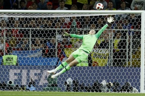 England goalkeeper Jordan Pickford goes airborne to make a save during the round of 16 match between Colombia and England at the 2018 soccer World Cup in the Spartak Stadium, in Moscow, Russia, Tuesday, July 3, 2018. (AP Photo/Victor R. Caivano)