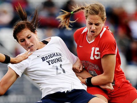 In this Nov. 5, 2009 photo, BYU forward Kassidy C. Shumway (21) is pulled to the ground by New Mexico defender Elizabeth Lambert (15) as she tries to maintain possession during the second half of an NCAA college soccer match in Provo, Utah. Lambert was suspended Friday, Nov. 6, 2009, for her infractions during the match. (AP Photo/Daily Herald, Patrick Smith)   Original Filename: New_Mexico_BYU_Soccer_UTPRO201.jpg