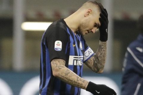 FILE - In this Sunday, Feb. 3, 2019 file photo, Inter Milan's Mauro Icardi walks off the pitch at the end of a Serie A soccer match between Inter Milan and Bologna, at the San Siro stadium in Milan, Italy. Two months ago, Mauro Icardi was one of Inter Milan's favored players, on Thursday, Feb. 14, 2019, he was training with just a handful of teammates at their training ground after a rapid fall from grace after Icardi and Inter have been in protracted talks over renewing his contract, which expires in 2021, with agent-wife Wanda Nara being particularly outspoken over the past month. (AP Photo/Luca Bruno, File)