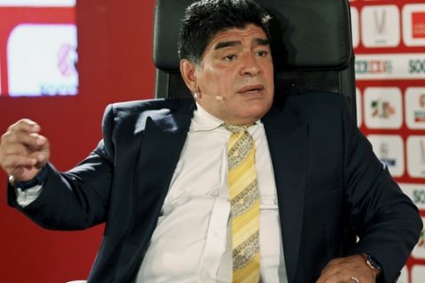 FILE - In this May 4, 2015, file photo, Argentina football legend Diego Maradona speaks on the second day of the SoccerEx Asian Forum conference in Southern Shuneh, Jordan. Maradona urged fellow Argentines on Wednesday, June 29, 2016, to leave Lionel Messi alone over the current stars decision to retire from Argentinas national team following its loss to Chile in the Copa America championship match. (AP Photo/Raad Adayleh, File)