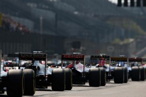 SHANGHAI, CHINA - APRIL 12:  Cars line up on the grid before the Formula One Grand Prix of China at Shanghai International Circuit on April 12, 2015 in Shanghai, China.  (Photo by Clive Mason/Getty Images)