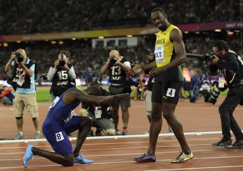 United States' Justin Gatlin bows to Jamaica's Usain Bolt after winning the Men's 100 meters final during the World Athletics Championships in London Saturday, Aug. 5, 2017. (AP Photo/Tim Ireland)