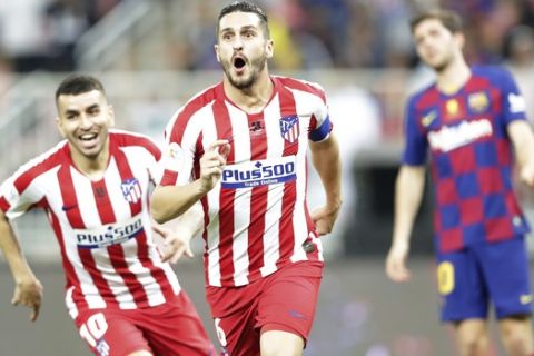 Atletico Madrid's Koke celebrates his side opening goal during the Spanish Super Cup semifinal soccer match between Barcelona and Atletico Madrid at King Abdullah stadium in Jiddah, Saudi Arabia, Thursday, Jan. 9, 2020. (AP Photo/Hassan Ammar)