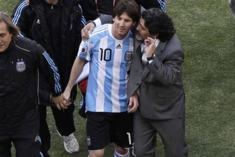 Argentina head coach Diego Maradona and Argentina's Lionel Messi after  the World Cup group B soccer match between Argentina and South Korea at Soccer City in Johannesburg, South Africa, Thursday, June 17, 2010.  (AP Photo/Marcio Jose Sanchez)