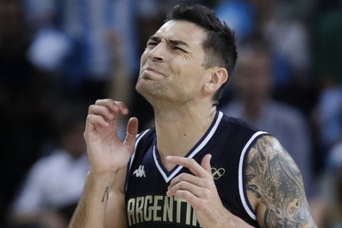 Argentina's Carlos Delfino (10) reacts to a call during a basketball game against Lithuania at the 2016 Summer Olympics in Rio de Janeiro, Brazil, Thursday, Aug. 11, 2016. (AP Photo/Charlie Neibergall)