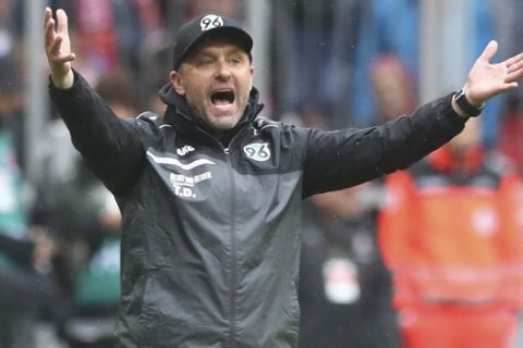 Hannover coach Thomas Doll reacts during the German Bundesliga soccer match between FC Bayern Munich and Hannover 96 in Munich, Germany, Saturday, May 4, 2019. (AP Photo/Matthias Schrader)