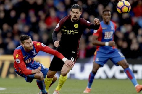 Crystal Palace's Joel Ward, left, competes for the ball with Manchester City's Nolito during the English Premier League soccer match between Crystal Palace and Manchester City at Selhurst Park stadium in London, Saturday, Nov. 19, 2016. (AP Photo/Matt Dunham)