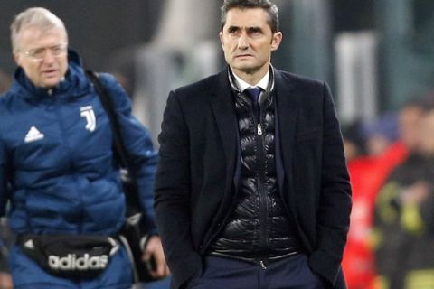 Barcelona coach Ernesto Valverde walks off the pitch at the end of the Champions League group D soccer match between Juventus and Barcelona, at the Allianz Stadium in Turin, Italy, Wednesday, Nov. 22, 2017. (AP Photo/Antonio Calanni)