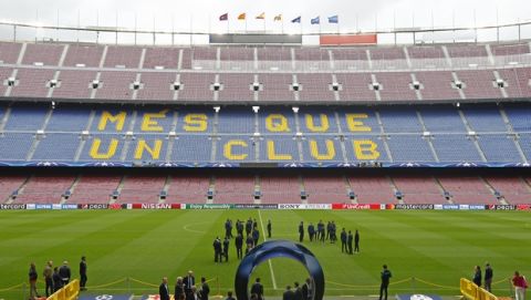 Juventus' players inspect the pitch at the Camp Nou stadium in Barcelona, Spain, Tuesday, April 18, 2017. FC Barcelona will play against Juventus in a Champions League quarterfinal, second-leg soccer match on Wednesday .(AP Photo/Manu Fernandez)