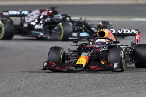 Red Bull driver Max Verstappen of the Netherlands steers his car followed by Mercedes driver Lewis Hamilton of Britain during the Bahrain Formula One Grand Prix at the Bahrain International Circuit in Sakhir, Bahrain, Sunday, March 28, 2021. (AP Photo/Kamran Jebreili)