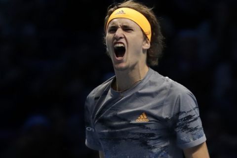 Alexander Zverev of Germany celebrates winning match point against Rafael Nadal of Spain during their ATP World Tour Finals singles tennis match at the O2 Arena in London, Monday, Nov. 11, 2019. (AP Photo/Kirsty Wigglesworth)