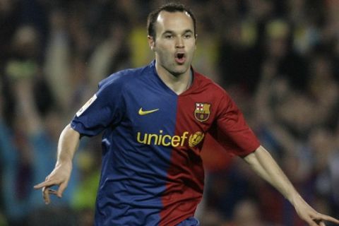 FC Barcelona's Andres Iniesta from Spain reacts after scoring against Sevilla during their Spanish La Liga soccer match at the Camp Nou stadium in Barcelona, Spain, Wednesday, April 22, 2009. (AP Photo/David Ramos)