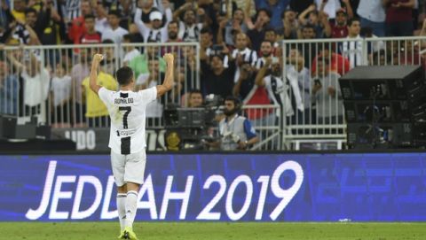 Juventus' Cristiano Ronaldo celebrates end of the Italian Super Cup final soccer match between AC Milan and Juventus at King Abdullah stadium in Jiddah, Saudi Arabia, Wednesday, Jan. 16, 2019. (AP Photo)