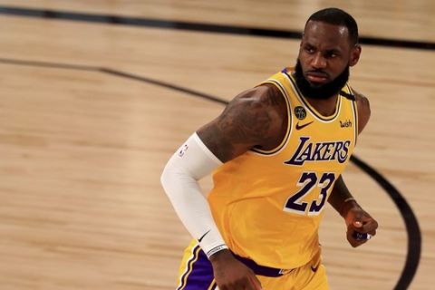 Los Angeles Lakers' LeBron James (23) runs downcourt against the Los Angeles Clippers during the first quarter of an NBA basketball game Thursday, July 30, 2020, in Lake Buena Vista, Fla. (Mike Ehrmann/Pool Photo via AP)