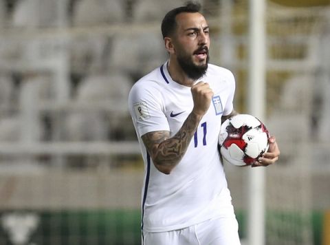 Greece's Kostas Mitroglou celebrates his goal against Cyprus during the World Cup Group H qualifying soccer match between Cyprus and Greece at GSP stadium in Nicosia, Cyprus, Saturday, Oct. 7, 2017. (AP Photo/Petros Karadjias)