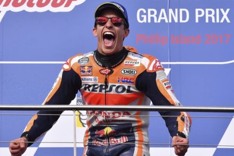 Spain's MotoGP rider Marc Marquez celebrates on the podium after winning the Australian Motorcycle Grand Prix at Phillip Island near Melbourne, Australia, Sunday, Oct. 22, 2017. (AP Photo/Andy Brownbill)