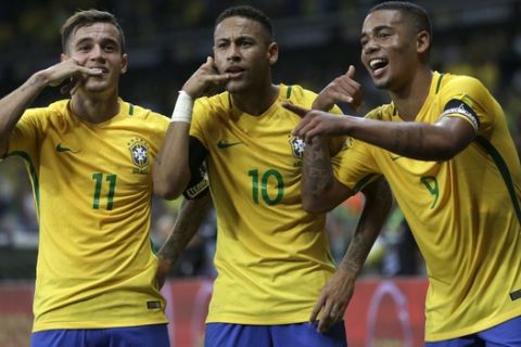 Brazil's Neymar, center, celebrates with teammates Philippe Coutinho, left, and Gabriel Jesus after scoring his side's second goal against Argentina during a 2018 World Cup qualifying soccer match at the Estadio Mineirao in Belo Horizonte, Brazil, Thursday Nov. 10, 2016.(AP Photo/Leo Correa)