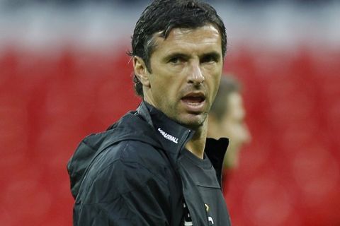 Wales' soccer team manager Gary Speed watches his team during a training session at Wembley Stadium in London, Monday, Sept. 5, 2011. Wales will play a Euro 2012 qualifier soccer match against England Tuesday at Wembley. (AP Photo/Kirsty Wigglesworth)