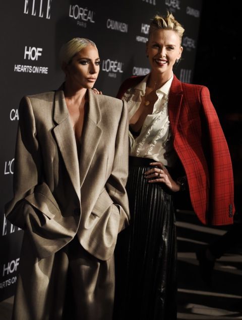 Honorees Lady Gaga, left, and Charlize Theron pose together at the 25th Annual ELLE Women in Hollywood Celebration, Monday, Oct. 15, 2018, in Los Angeles. (Photo by Chris Pizzello/Invision/AP)