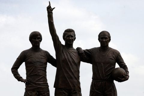 A general view of Manchester United's newly unveiled statue of, left to right, George Best, Denis Law and Bobby Charlton called "Holy Trinity" is seen, in memory of United's 40th anniversary of their first European Cup win over Benfica, at Old Trafford Stadium, Manchester, England, Thursday May 29, 2008. The ceremony took place at Old Trafford, 40 years to the day since the club lifted the European Cup for the first time. The statue is the work of sculptor Philip Jackson and will stand opposite the one of Sir Matt Busby at the front of the stadium. Charlton, Best and Law scored 665 goals between them for United, and, between 1964 and 1968, all won the coveted European Footballer of the Year award. (AP Photo/Paul Thomas)