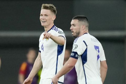 Scotland's Scott McTominay, center, celebrates scoring a goal before it was disallowed during the Euro 2024 group A qualifying soccer match between Spain and Scotland at La Cartuja stadium in Seville, Spain, Thursday, Oct. 12, 2023. (AP Photo/Jose Breton)