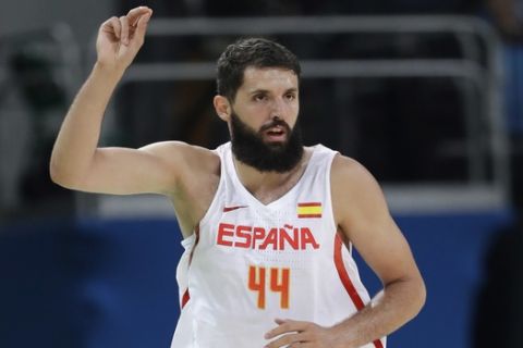 Spain's Nikola Mirotic (44) signals after a score against Argentina during a men's basketball game at the 2016 Summer Olympics in Rio de Janeiro, Brazil, Monday, Aug. 15, 2016. (AP Photo/Eric Gay)