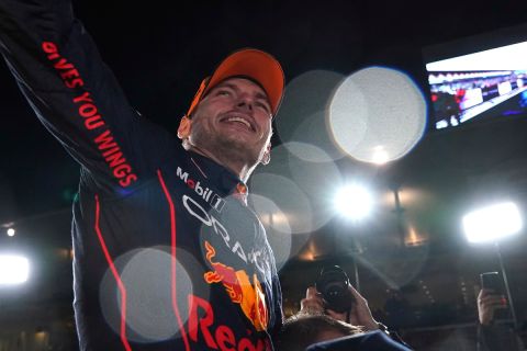 Red Bull driver Max Verstappen, of the Netherlands celebrates with teammates as he became F1 drivers world champion, during the Japanese Formula One Grand Prix at the Suzuka Circuit in Suzuka, central Japan, Sunday, Oct. 9, 2022. (AP Photo/Toru Hanai)