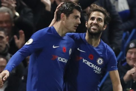 Chelsea's Alvaro Morata, left, and Chelsea's Cesc Fabregas celebrate scoring their sides first goal during the English Premier League soccer match between Chelsea and Manchester United at Stamford Bridge stadium in London, Sunday, Nov. 5, 2017. (AP Photo/Kirsty Wigglesworth)