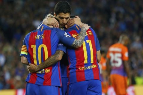Barcelona's Lionel Messi, Barcelona's Luis Suarez and Barcelona's Neymar, from left to right, celebrate their fourth goal during a Champions League, Group C soccer match between Barcelona and Manchester City, at the Camp Nou stadium in Barcelona, Wednesday, Oct. 19, 2016. (AP Photo/Francisco Seco)