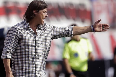 River Plate's coach Matias Almeyda gestures during an Argentine soccer league match against Boca Juniors in Buenos Aires,  Argentina, Sunday, Oct. 28, 2012. The match ended 2-2. (AP Photo/Victor R. Caivano)