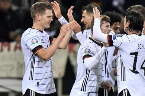 Germany's Matthias Ginter, left, is celebrated after he scored the opening goal during the Euro 2020 group C qualifying soccer match between Germany and Belarus in Moenchengladbach, Germany, Saturday, Nov. 16, 2019. (AP Photo/Martin Meissner)
