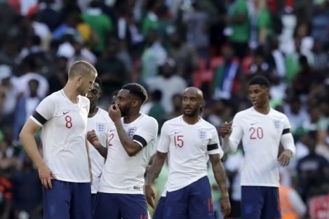 England's Eric Dier, left, speaks with Danny Rose at the end of the friendly soccer match between England and Nigeria at Wembley stadium in London, Saturday, June 2, 2018. (AP Photo/Matt Dunham)