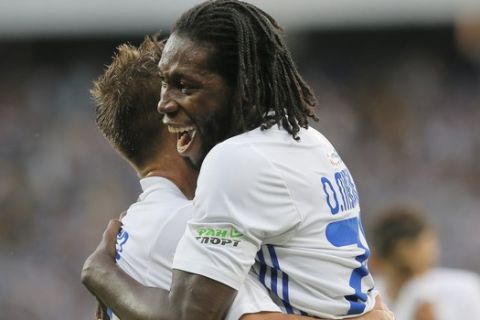 Dynamo Kiev's Dieumerci Mbokani celebrates with his teammate scoring his side's second goal during the Champions League third qualifying round, 1st leg soccer match between Dynamo Kiev and Young Boys at the Olympiyskiy Stadium in Kiev, Ukraine, Wednesday, July 26, 2017. (AP Photo/Efrem Lukatsky)