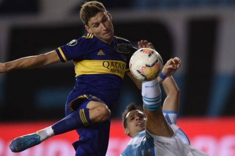 Franco Soldano of Argentina's Boca Juniors, left, and Leonel Miranda of Argentina's Racing Club battle for the ball during a Copa Libertadores quarterfinal first leg soccer match at the Presidente Peron stadium in Buenos Aires, Argentina, Wednesday, Dec. 16, 2020. (AP Photo/Gustavo Garello)