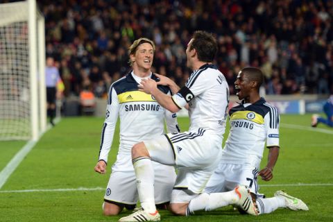 Chelsea's Spanish forward Fernando Torres (L) celebrates with teammates midfielder Frank Lampard (C) and Brazilian midfielder  Ramires (R) after scoring during the UEFA Champions League second leg semi-final football match Barcelona against Chelsea at the Cam Nou stadium in Barcelona on April 24, 2012. Ten-man Chelsea reached the Champions League final after drawing 2-2 with holders Barcelona in their semi-final final second leg clash here to progress 3-2 on aggregate.  AFP PHOTO / ADRIAN DENNIS (Photo credit should read ADRIAN DENNIS/AFP/Getty Images)