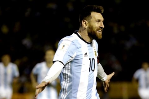 In this Tuesday, Oct. 10, 2017 photo, Argentina's Lionel Messi celebrates after scoring his third goal against Ecuador during their 2018 World Cup qualifying soccer match at the Atahualpa Olympic Stadium in Quito, Ecuador. Messis three goals lifted Argentina into the World Cup on the last day of South American qualifying, keeping the Argentines from missing out for the first time since 1970. (AP Photo/Fernando Vergara)