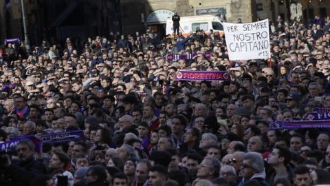 Fiorentina fans attend the funeral ceremony of Italian player Davide Astori in Florence, Italy, Thursday, March 8, 2018. The 31-year-old Astori was found dead in his hotel room on Sunday after a suspected cardiac arrest before his team was set to play an Italian league match at Udinese. (AP Photo/Alessandra Tarantino)