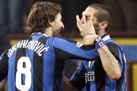 Inter Milan forward Zlatan Ibrahimovic of Sweden, left, celebrates with his teammate Marco Materazzi  after scoring against Messina during an Italian major league soccer match at the San Siro stadium  in Milan, Italy, Sunday, Dec.17 , 2006. (AP Photo/Luca Bruno)