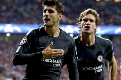 Chelsea's scorer Alvaro Morata, left, and his teammate Marcos Alonso, right, celebrate their side's first goal during a Champions League group C soccer match between Atletico Madrid and Chelsea at the Wanda Metropolitano stadium in Madrid, Spain, Wednesday, Sept. 27, 2017. (AP Photo/Francisco Seco)