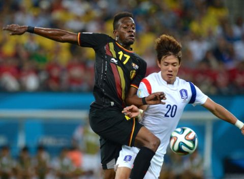 SAO PAULO, BRAZIL - JUNE 26: Belgium's Divock Origi (17) vies for the ball with SouthKorea's Hong Jeongho (20) during the 2014 FIFA World Cup group H soccer match between South Korea and Belgium in Sao Paulo, Brazil on June 26, 2014. (Photo by Cem Ozdel/Anadolu Agency/Getty Images)