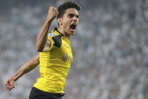 FILE - In this file photo dated Wednesday, Sept. 14, 2016, Dortmund's Marc Bartra celebrates after scoring during the Champions League Group F soccer match between Legia Warsaw and Dortmund at Stadion Wojska Polskiego in Warsaw, Poland. Borussia Dortmund said Tuesday April 11, 2017, defender Marc Bartra was injured in an explosion near team bus Tuesday and is currently in a hospital. (AP Photo/Alik Keplicz, FILE)