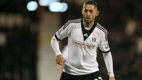 Fulham's Clint Dempsey watches the ball during their 4th round replay English FA Cup soccer match between Fulham and Sheffield United at Craven Cottage stadium in London, Tuesday, Feb. 4, 2014. (AP Photo/Alastair Grant)