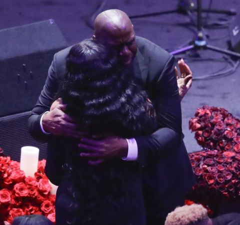 Former Los Angeles Lakers' Magic Johnson hugs Pam Bryant mother of Kobe Bryant during a celebration of life for Kobe Bryant and his daughter Gianna Monday, Feb. 24, 2020, in Los Angeles. (AP Photo/Marcio Jose Sanchez)